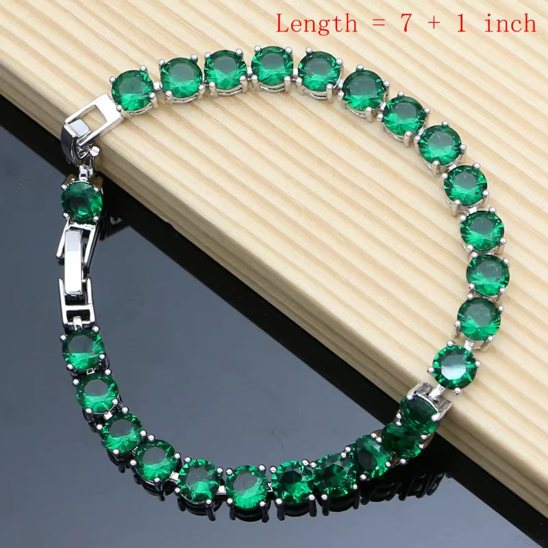 Silver tennis-style bracelet with round green gemstones and hinged safety clasp