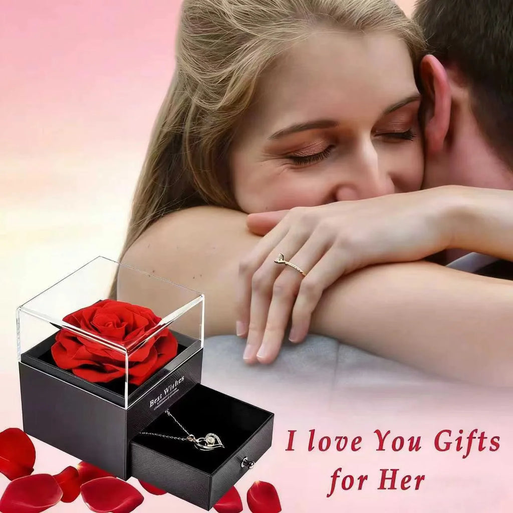 Clear-top jewelry box with preserved red rose and heart pendant necklace on chain