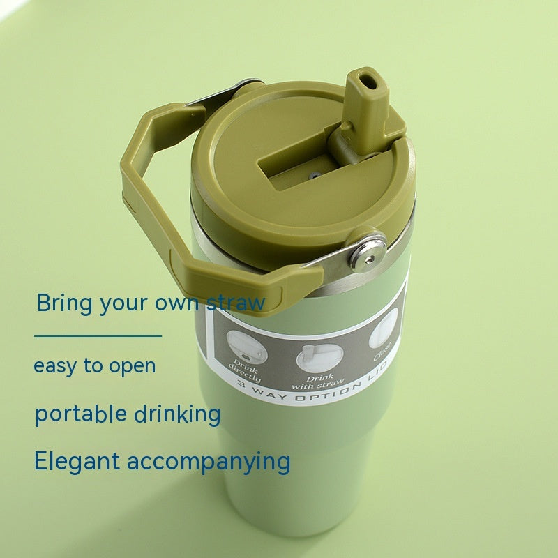 Green vacuum insulated tumbler lid with built-in straw opening and flip cover