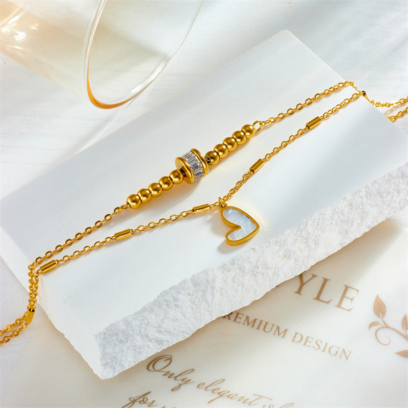 Gold double-layer heart anklet with heart pendant and cylindrical center clasp