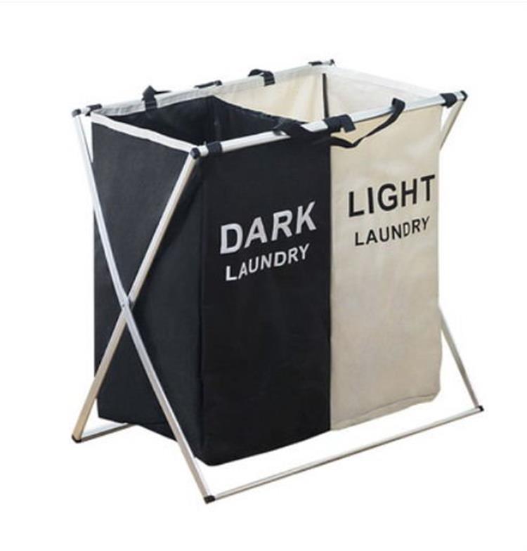 Two-compartment collapsible laundry hamper, black and light beige, with handles and metal frame