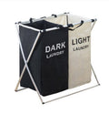 Two-compartment collapsible laundry hamper, black and light beige, foldable frame with carrying handles