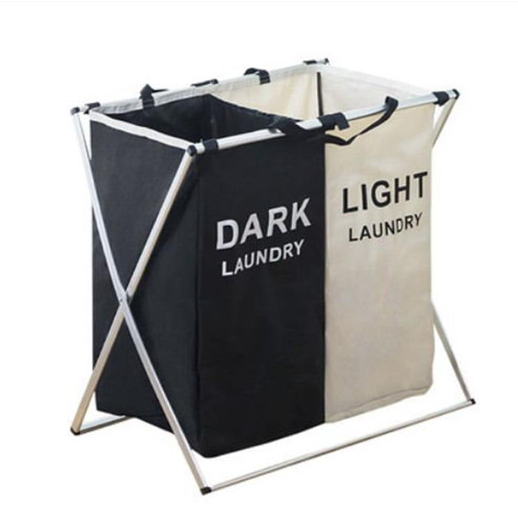 Two-compartment collapsible laundry hamper, dark and light beige panels, metal legs, top handles