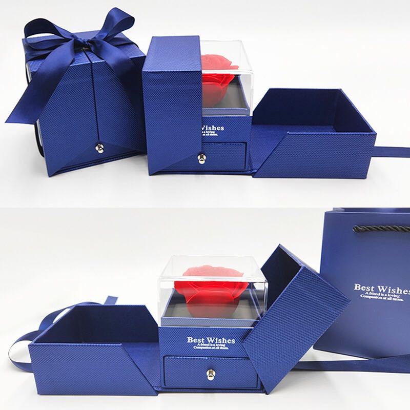 Blue jewelry gift box set with red preserved rose, clear window, and navy bow top