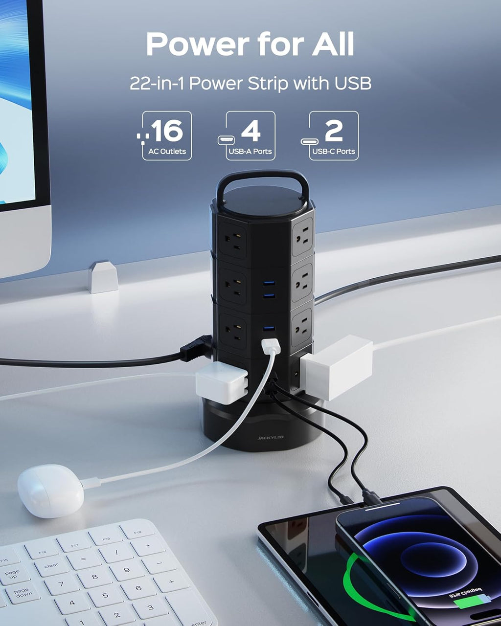Black power strip tower plugged in on a desk with AC outlets and USB ports exposed