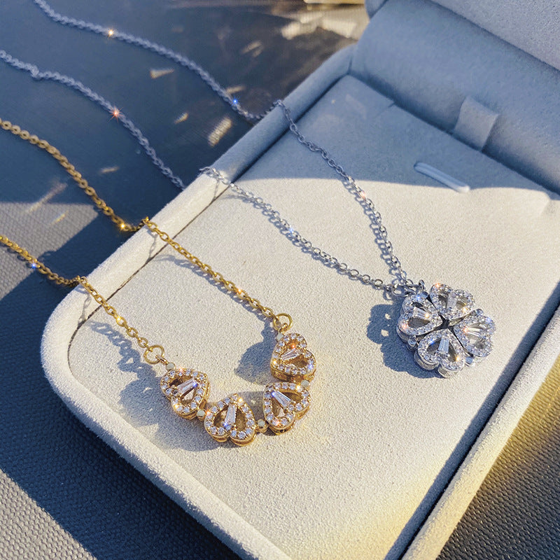 Gold and silver clover-heart necklace with heart-shaped crystal pendant