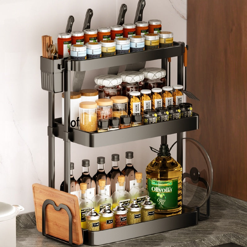 Black multi-layer kitchen storage rack with three levels for spice jars, bottles, and cookware