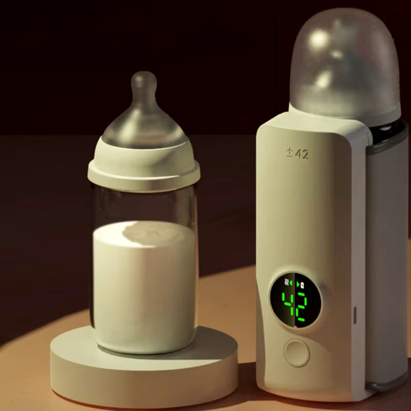 White baby bottle warmer charging beside an infant bottle on a round base