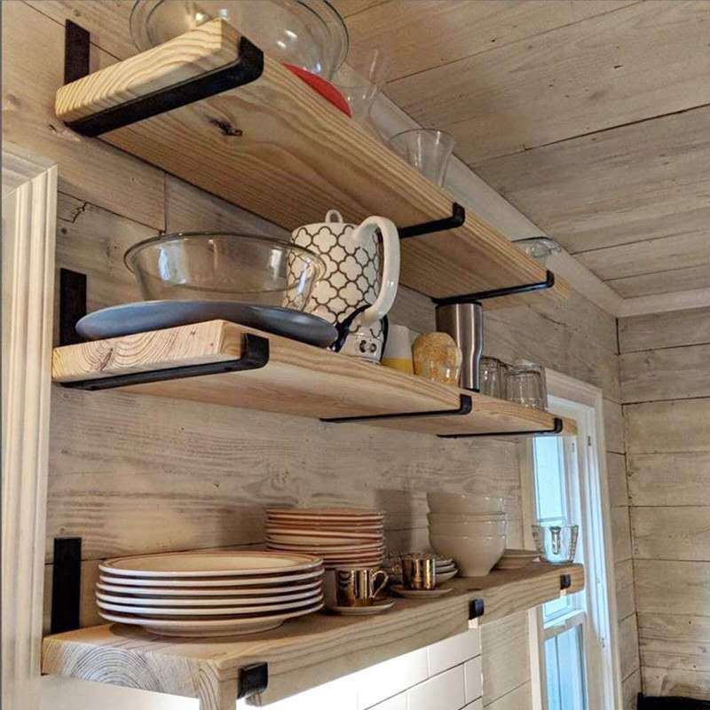 Black iron wall shelf support brackets with curved ends and screw holes