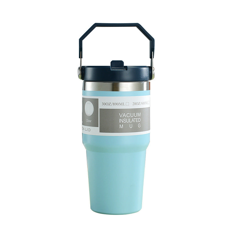 Vacuum insulated stainless steel travel tumbler with handle and lid, light blue