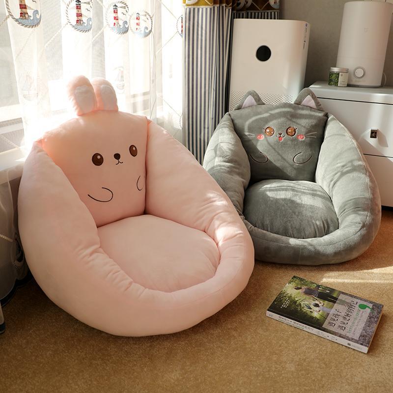 Round character floor cushion seat pad in pale pink with cute bear face graphic.