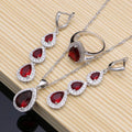 Sterling silver jewelry set with red teardrop gemstones, earrings and necklace