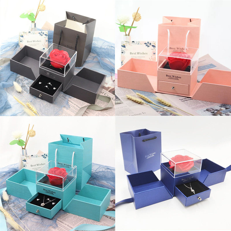 Jewelry gift box set with red rose in dark gray and pink compartments with clear display