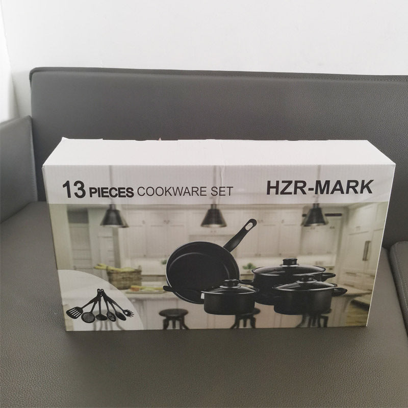 Cookware set box featuring black pots, pans, and utensil silhouettes