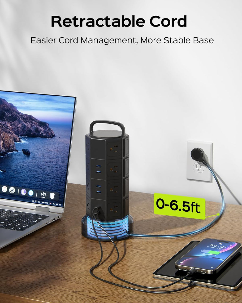 Black power strip tower on a table with retractable cord and USB charging ports
