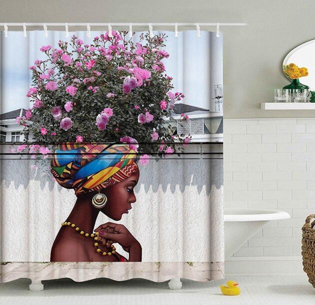 Shower curtain featuring a woman portrait with colorful headwrap and pink floral graphic