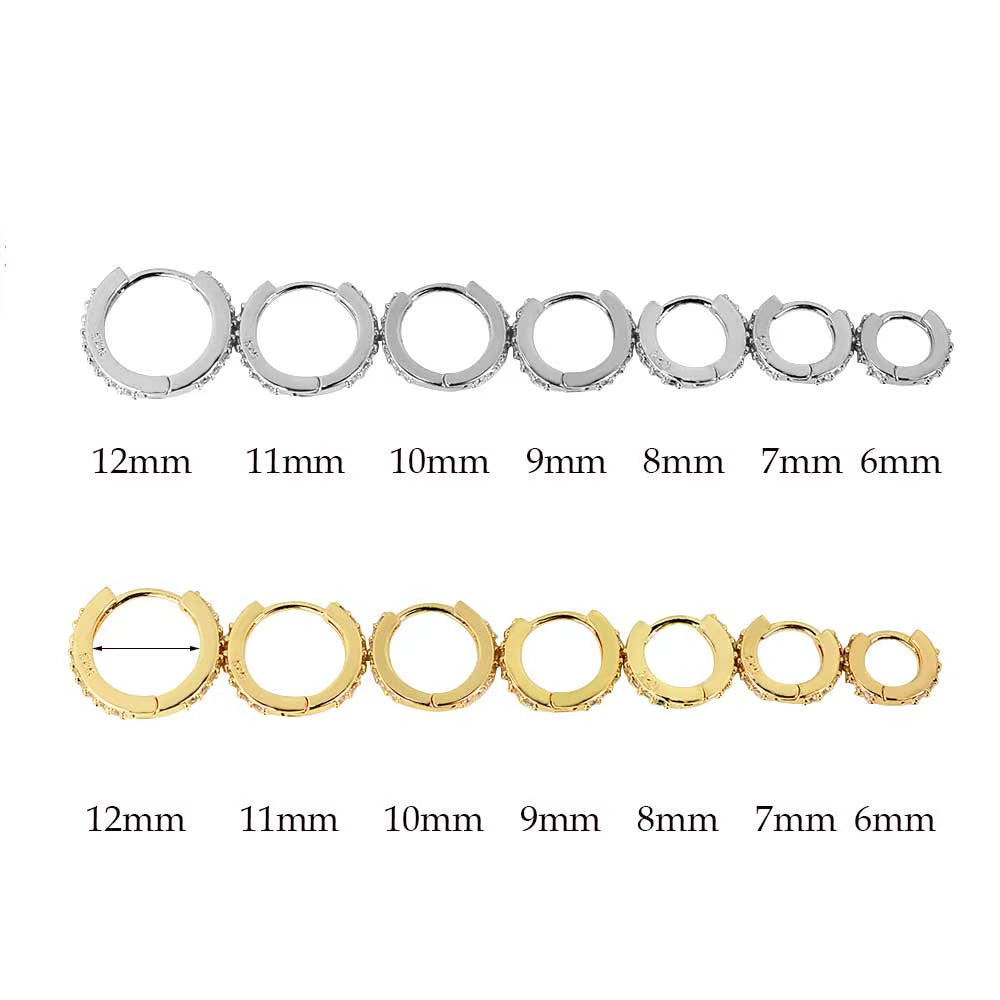 Collection of silver and gold crystal huggie hoop earrings with round stone accents