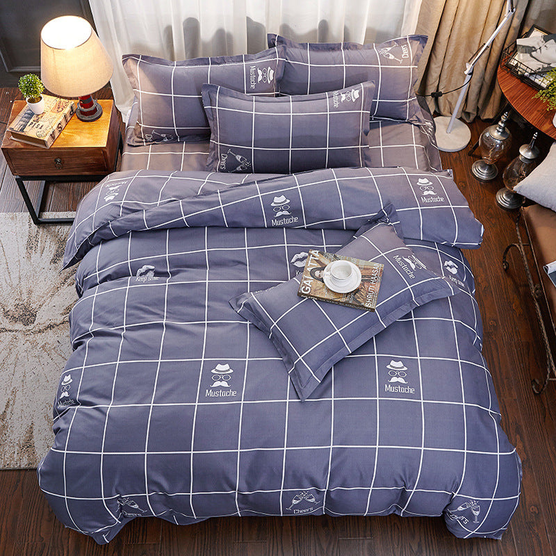 Cotton bedding set: navy duvet with white grid and mustache icons, plus matching pillowcases