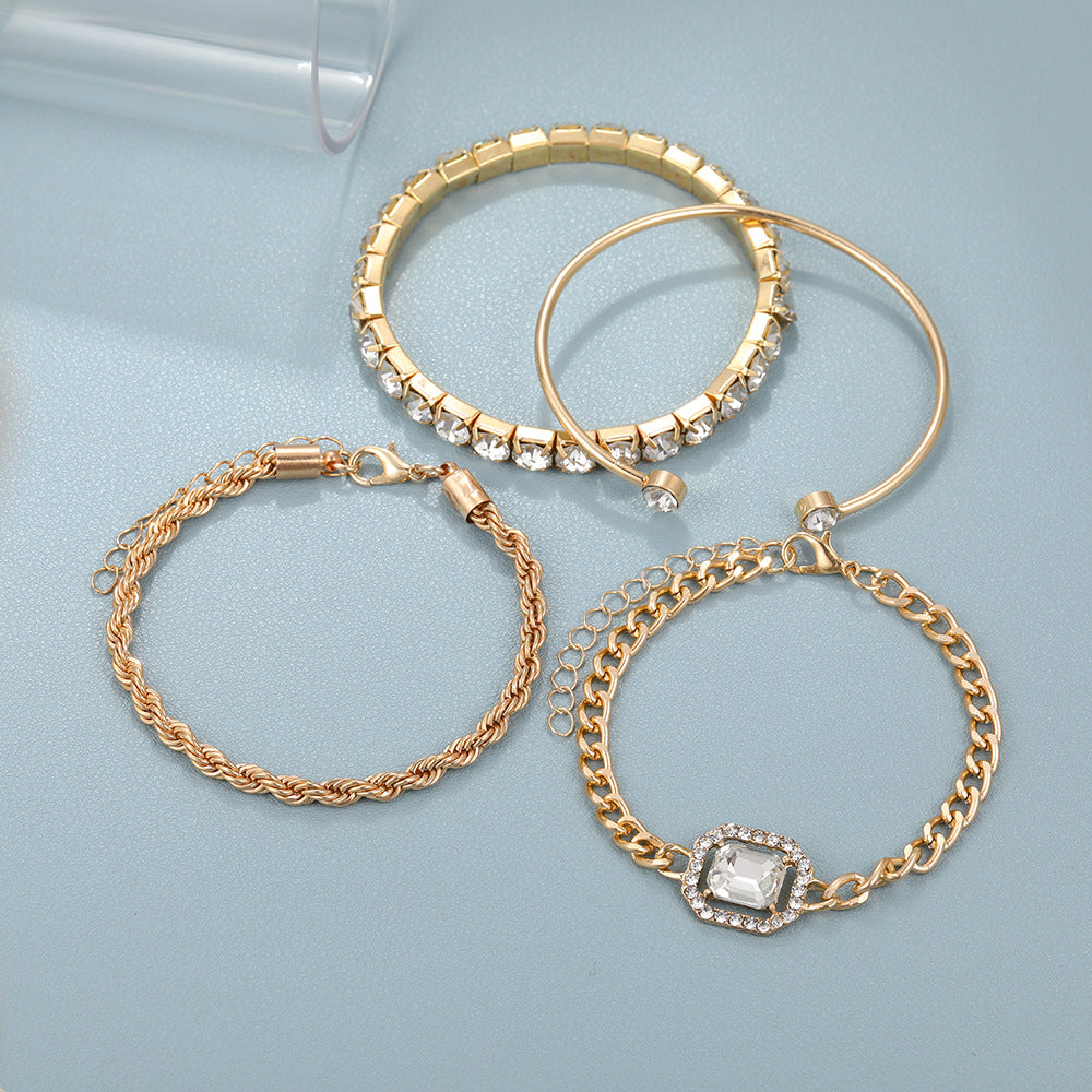 Gold-toned crystal bracelet set with stacked cuffs and chain bracelets with clear stones
