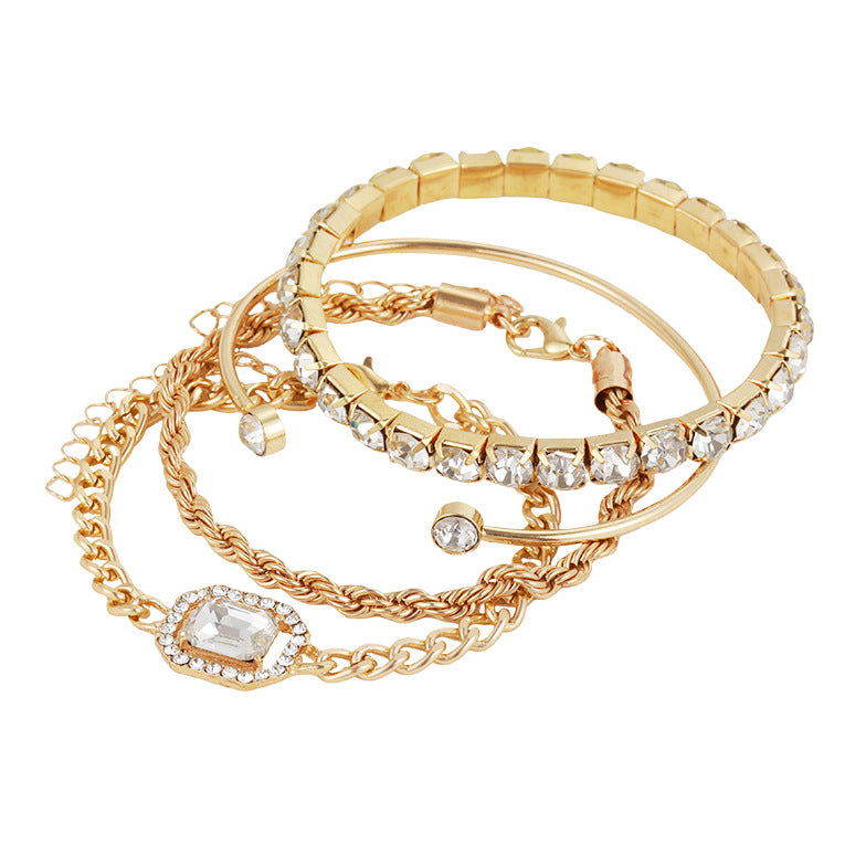Gold-toned rhinestone bracelet set with chain links, round stones, and stackable cuffs