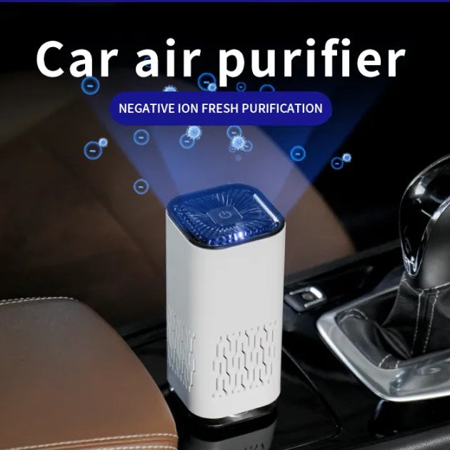 White portable air purifier with blue-lit top fan, on a car seat.