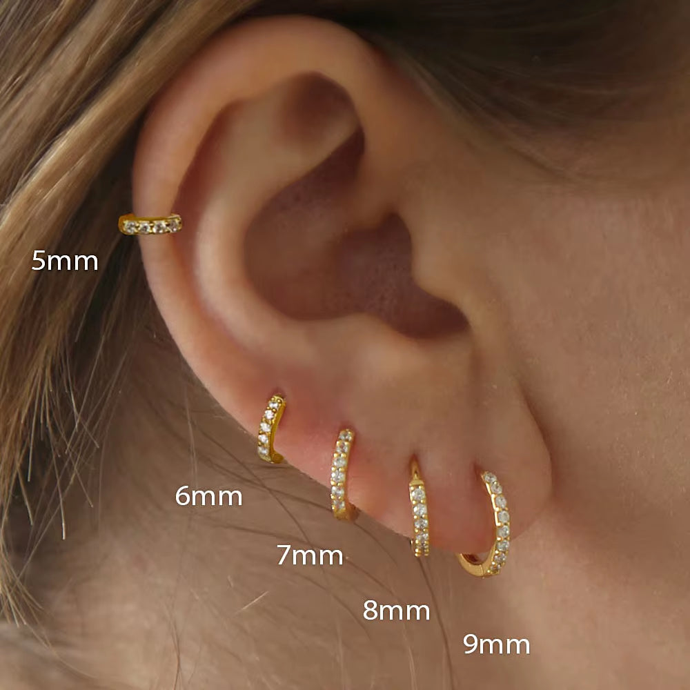 Gold crystal huggie hoop earrings with small round stones for cartilage piercing