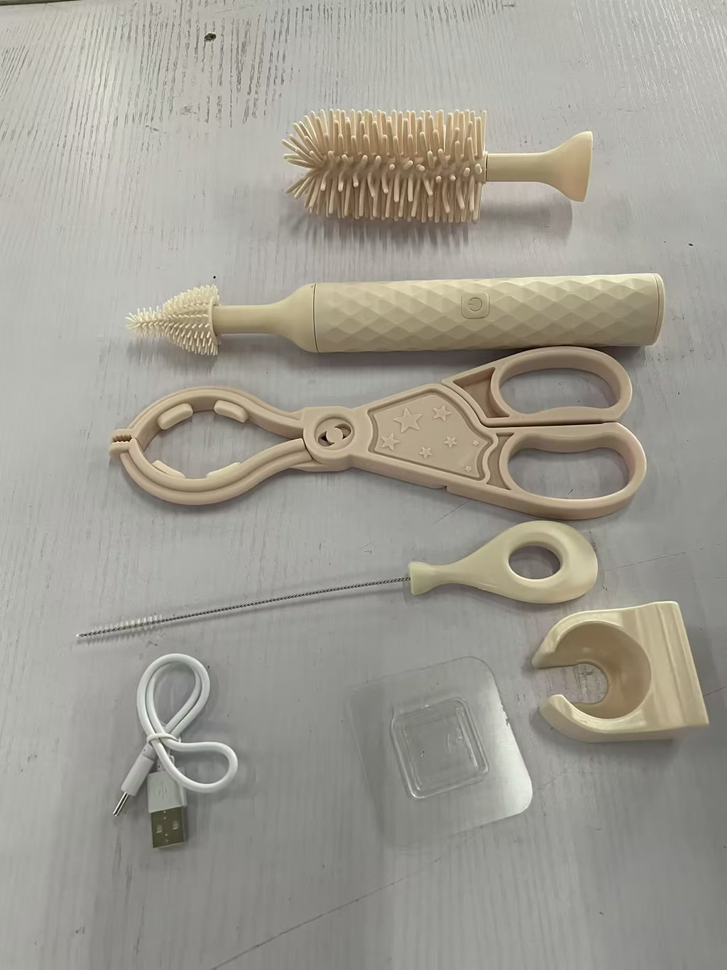 Silicone baby bottle brush set with cream bottle brush, nipple brush, and tools