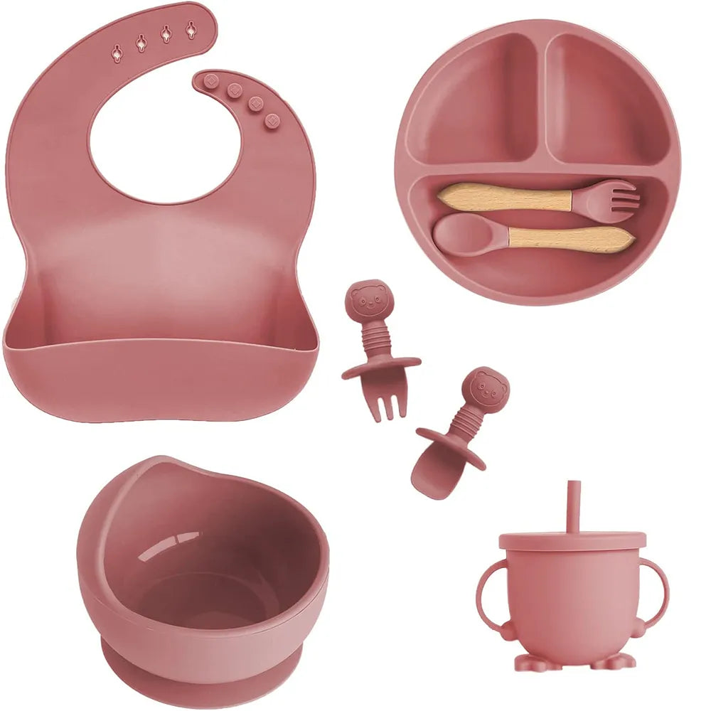 Baby silicone feeding set in dark pink: bib, suction bowl, cup, utensils, extra pieces