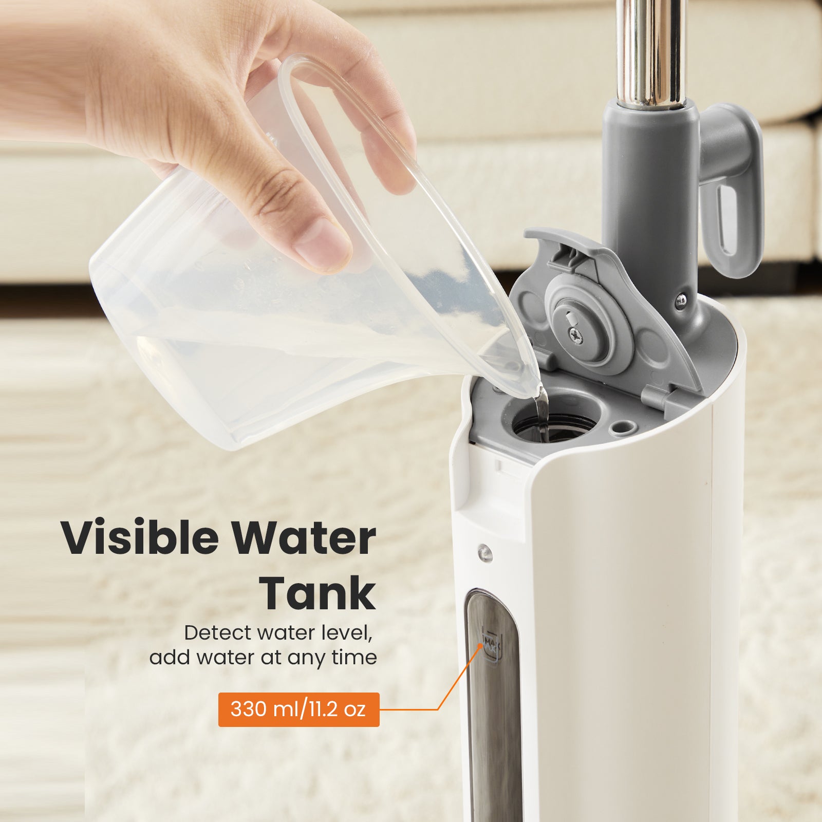 Steam mop water tank being filled with clear water from a cup