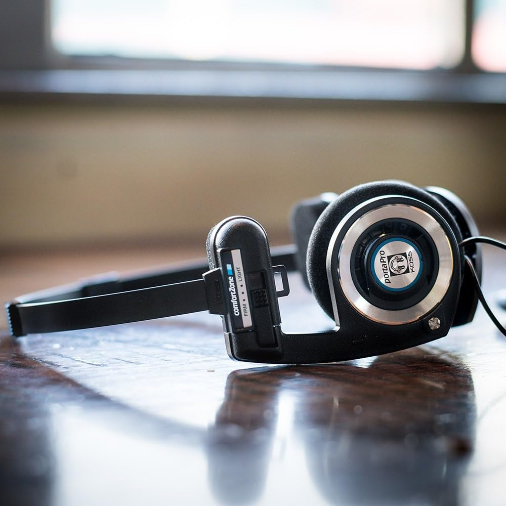 Black on-ear headphones resting with earcups and headband visible