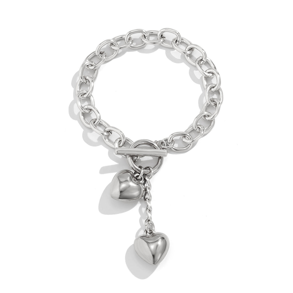 Silver chain bracelet with heart dangle charms and ring clasp