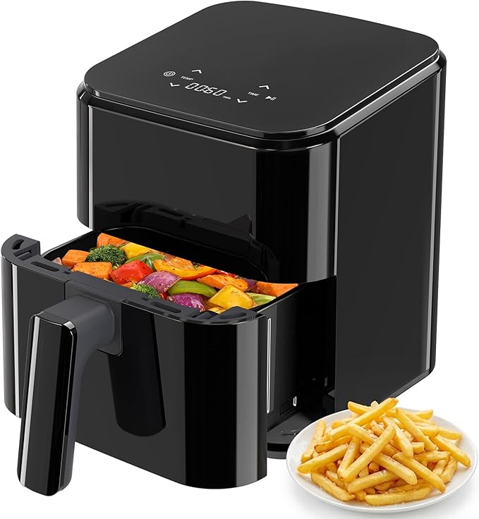 Compact air fryer, all-black design; open drawer with cooked vegetables and fries