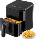 Compact air fryer, all-black design; open drawer with cooked vegetables and fries
