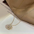 Gold clover-heart necklace with four-leaf clover crystal pendant on chain