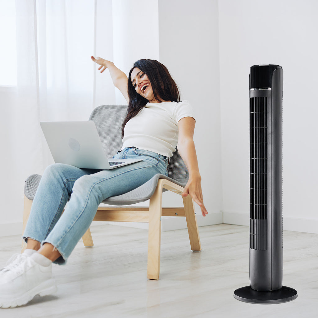 Tall standing cooling fan with black top, vertical grille, and round base