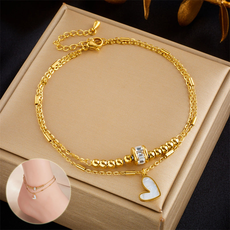 Gold double-layer heart anklet with linked chains and small heart charm