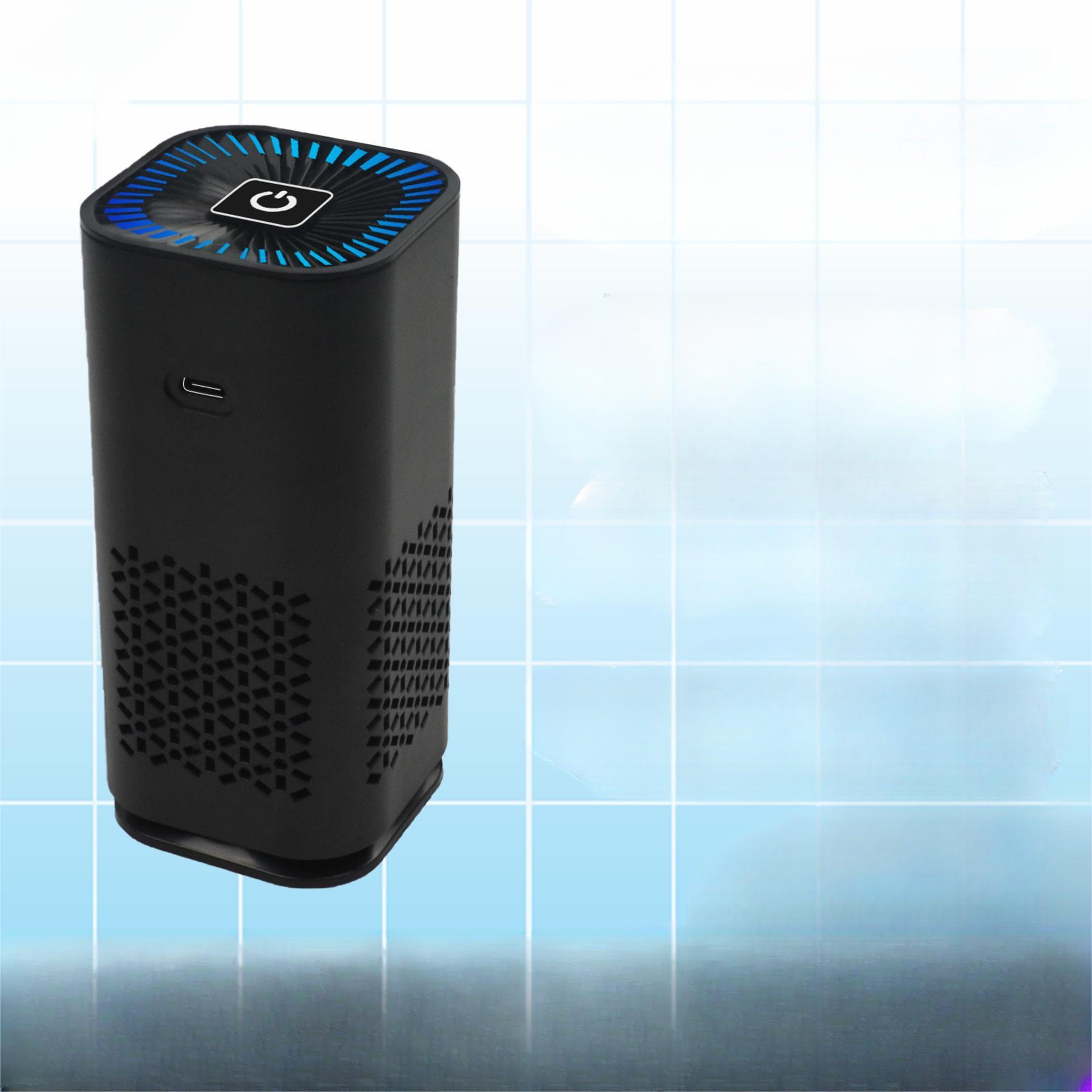 Portable air purifier, black compact tower with top control panel and vented sides