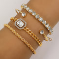 Gold-toned crystal bracelet set on wrist with square centerpiece, chain links, and cuff