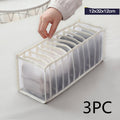White fabric underwear drawer organizer with parallel compartments and curved divider slats