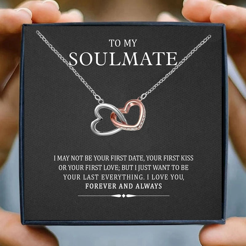 Heart infinity pendant necklace on a silver-tone chain with rose-gold accent heart